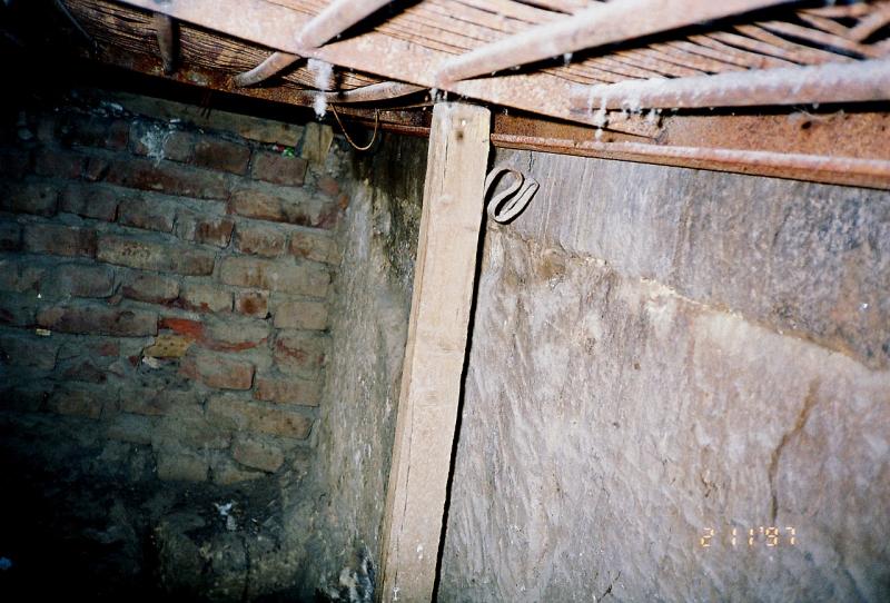 Flat wall of King's Chamber under it's floor. Photo in the pit, 1997.