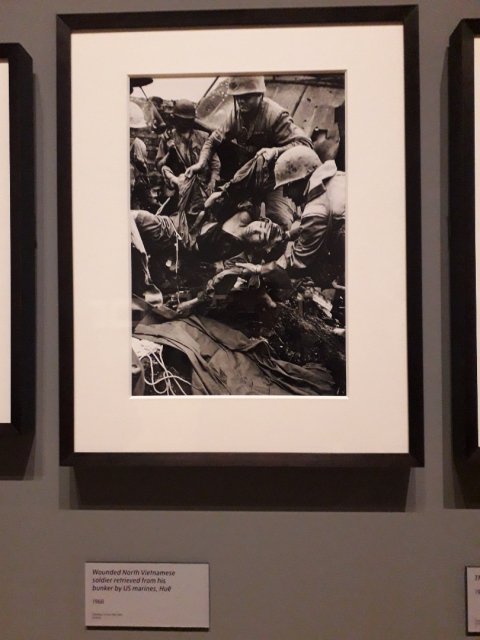 Wounded North Vietnamese soldier retrieved from hi bunker by US marines, Hue