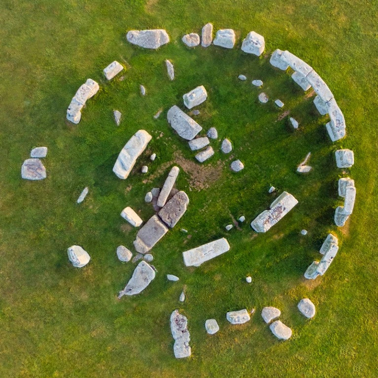 The Altar Stone is located at the centre of the circle and lies recumbent under two other slabs.