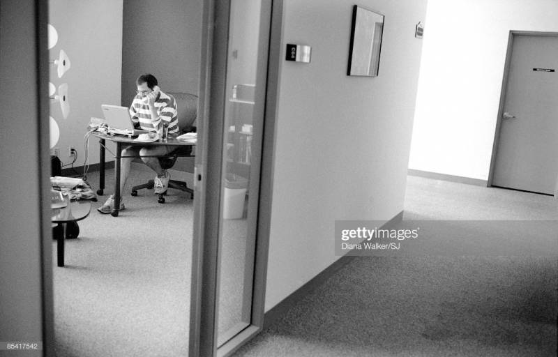 Steve Jobs inside his office at Pixar in 1997, as seen from outside. Picture from Diana Walker.