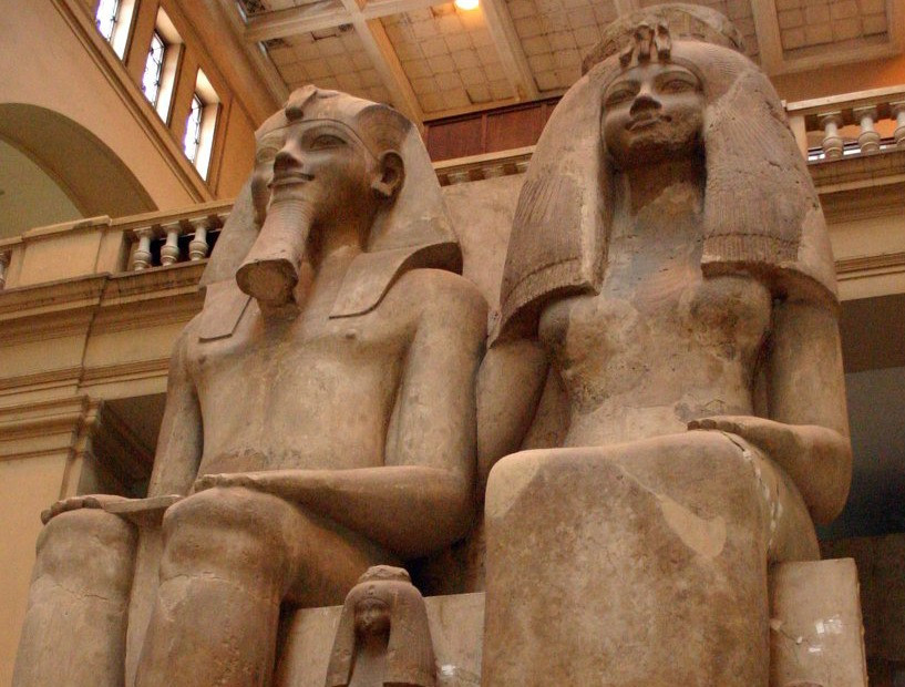 The colossal statue, kept in the Cairo Museum, of Amenhotep III and his wife, the Nubian Tiye. The p