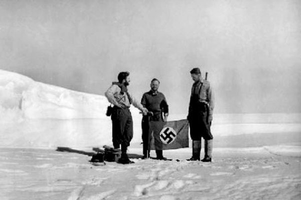 A photo showing the men of the expedition waving the Nazi flag. Today the melting ice increasingly r