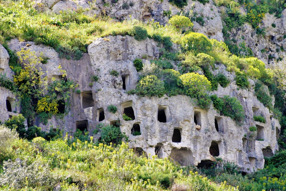 A system of dwellings similar to those of the Guanches is found in Sicily in Cassibile, in the provi