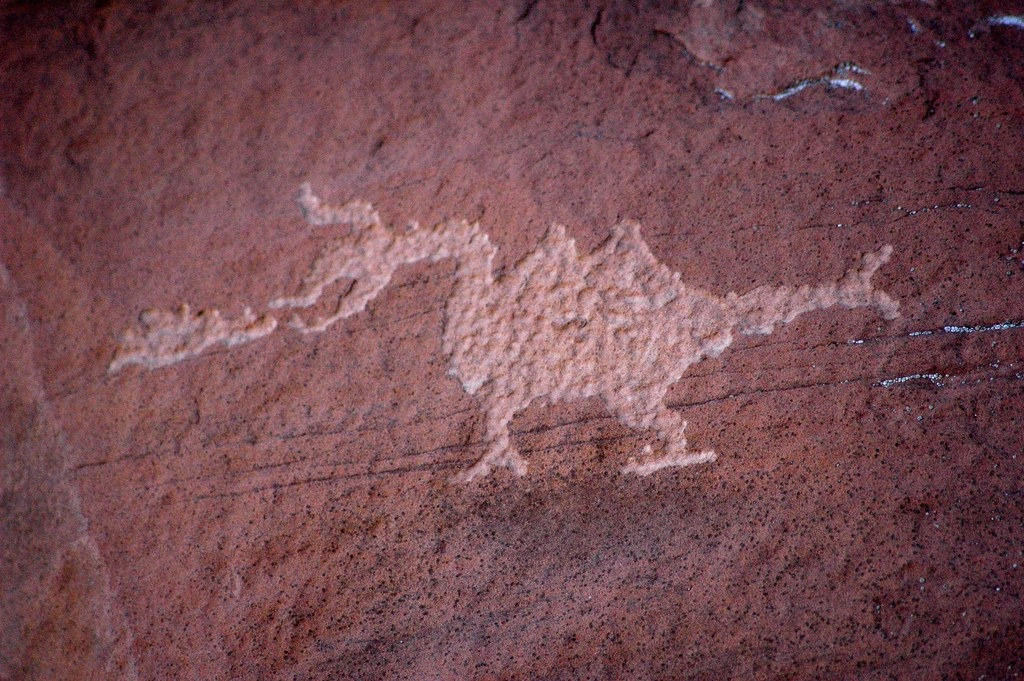 Graffiti and rock paintings depicting prehistoric animals: Puff the magic dragon , a real dragon of 