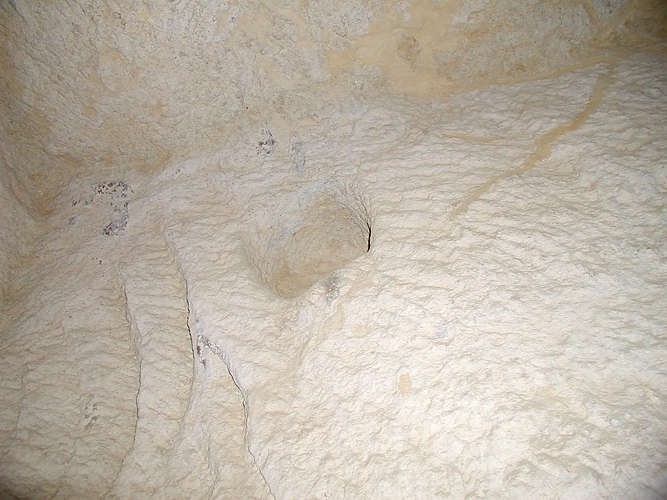 Above each slot for the portcullis stones is a socket for a beam which would have supported the ston