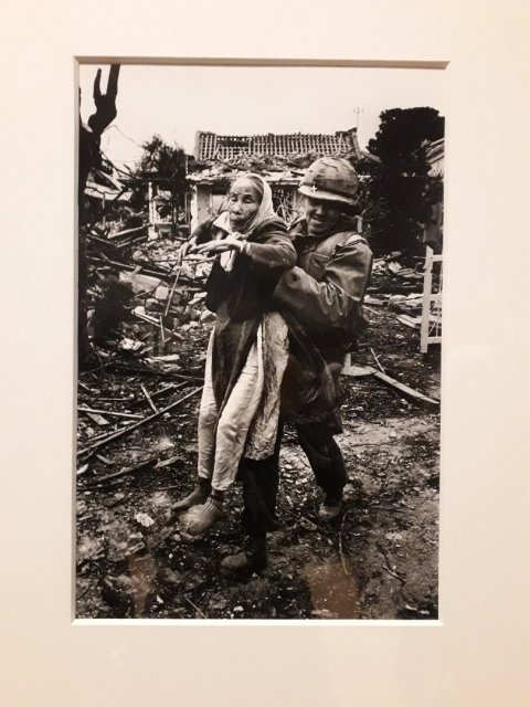 US army chaplain rescuing Vietnamese women, Hue