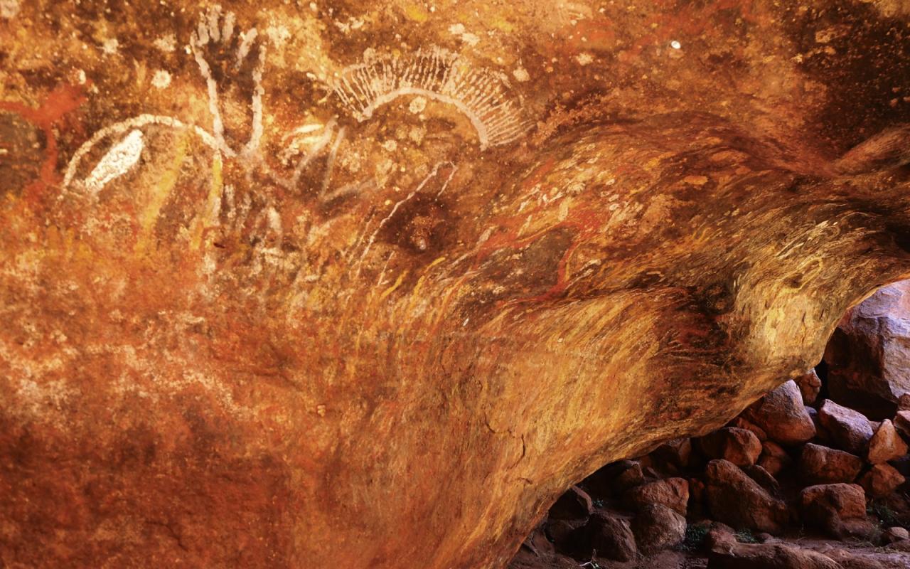 Deities carved into the Uluru caves.